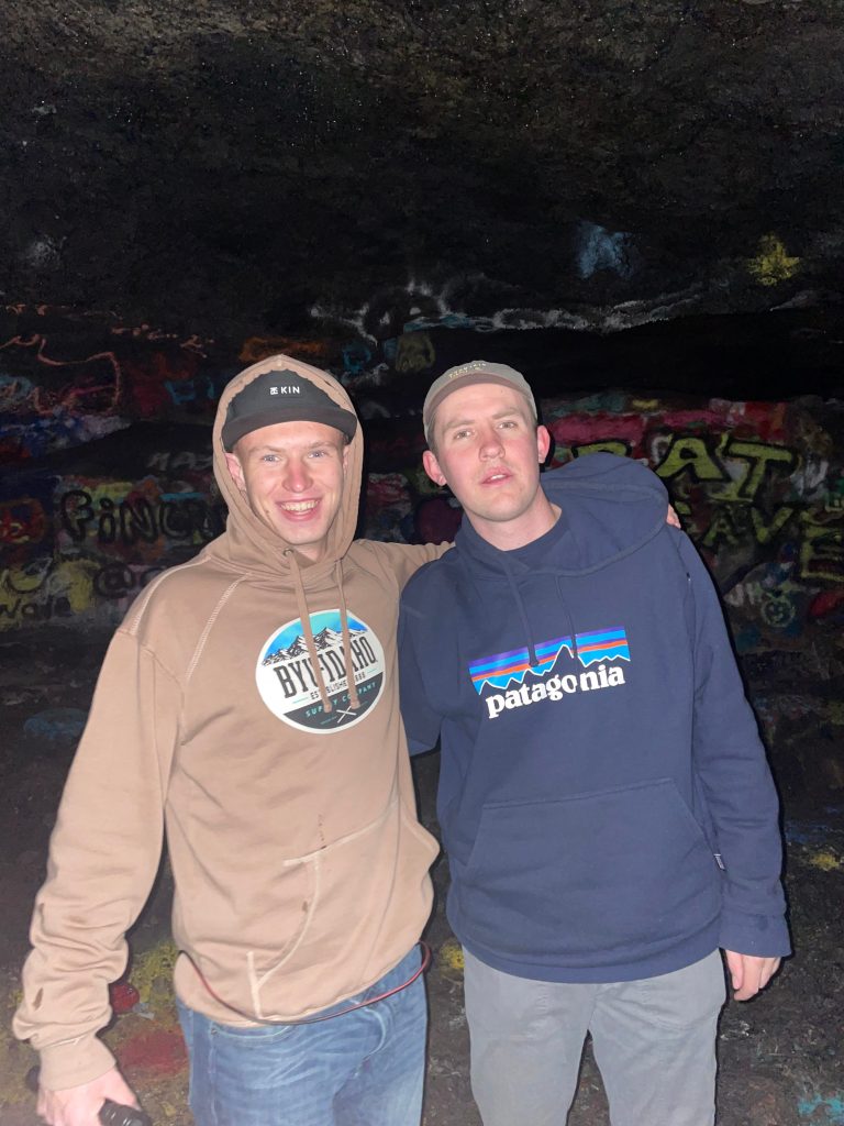 Me and my pal at the end of the civil defense cave with graphiti on the cave walls.