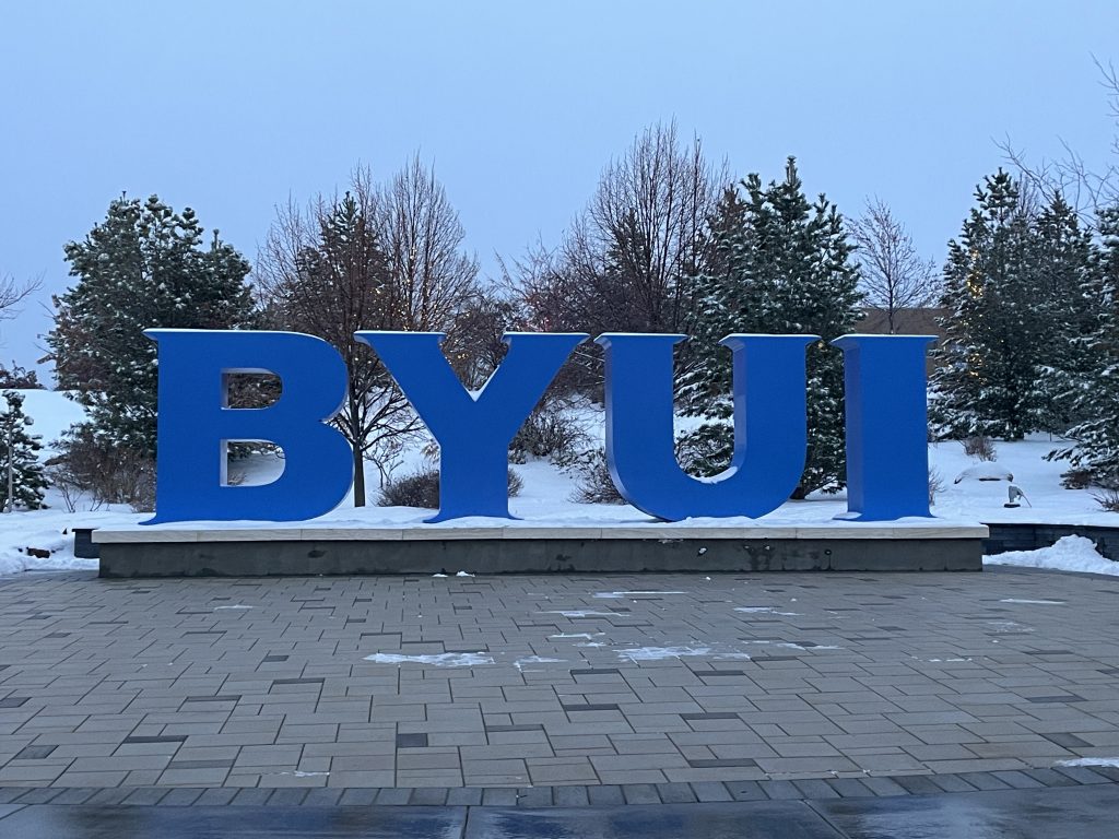 BYU-I Metal letters on campus with a snowy background as a good representation of Rexburg Idaho, becuase BYU-I is in Rexburg Idaho.