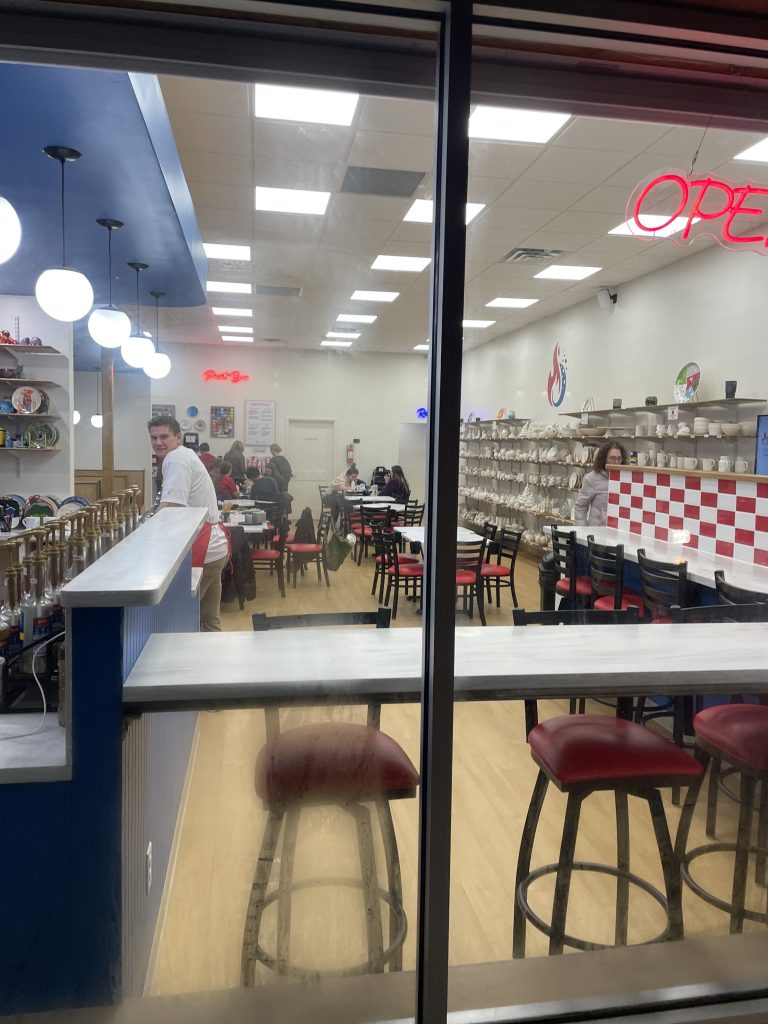 Window looking into Fire and Fizz pottery painting place in Rexburg.