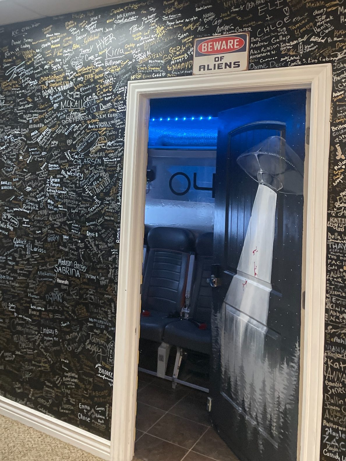 Rexburg Re-Escape wall logo surrounded by player signatures