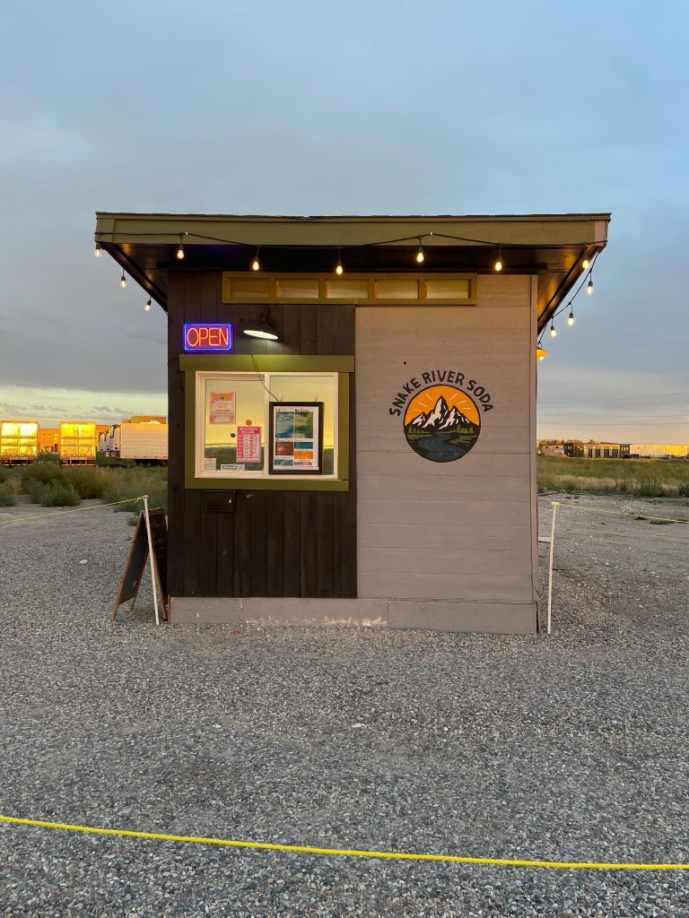 front view of snake river soda drive through stand in rexburg idaho