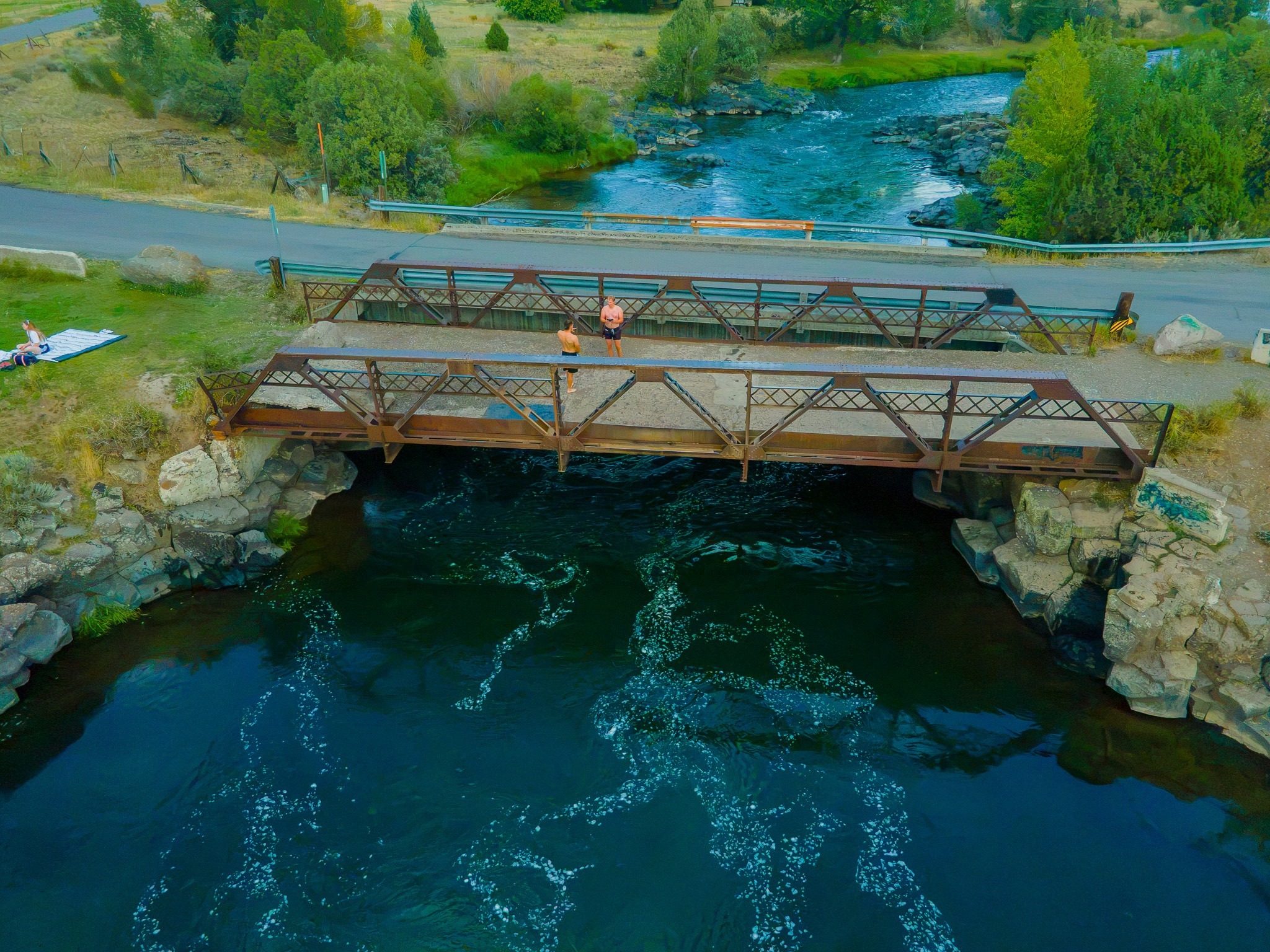 Jumpers standing on Twin Bridges near Rexburg, Idaho, preparing to jump
