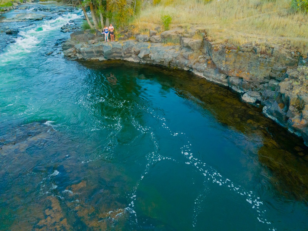 The rock ledge jumping spot at the secret swimming hole on the Fall River