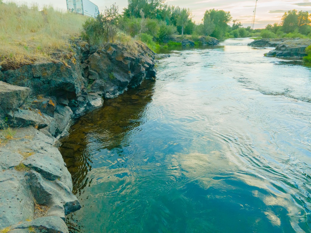 The rocky shelf along the Fall River near the secret swimming hole in Idaho