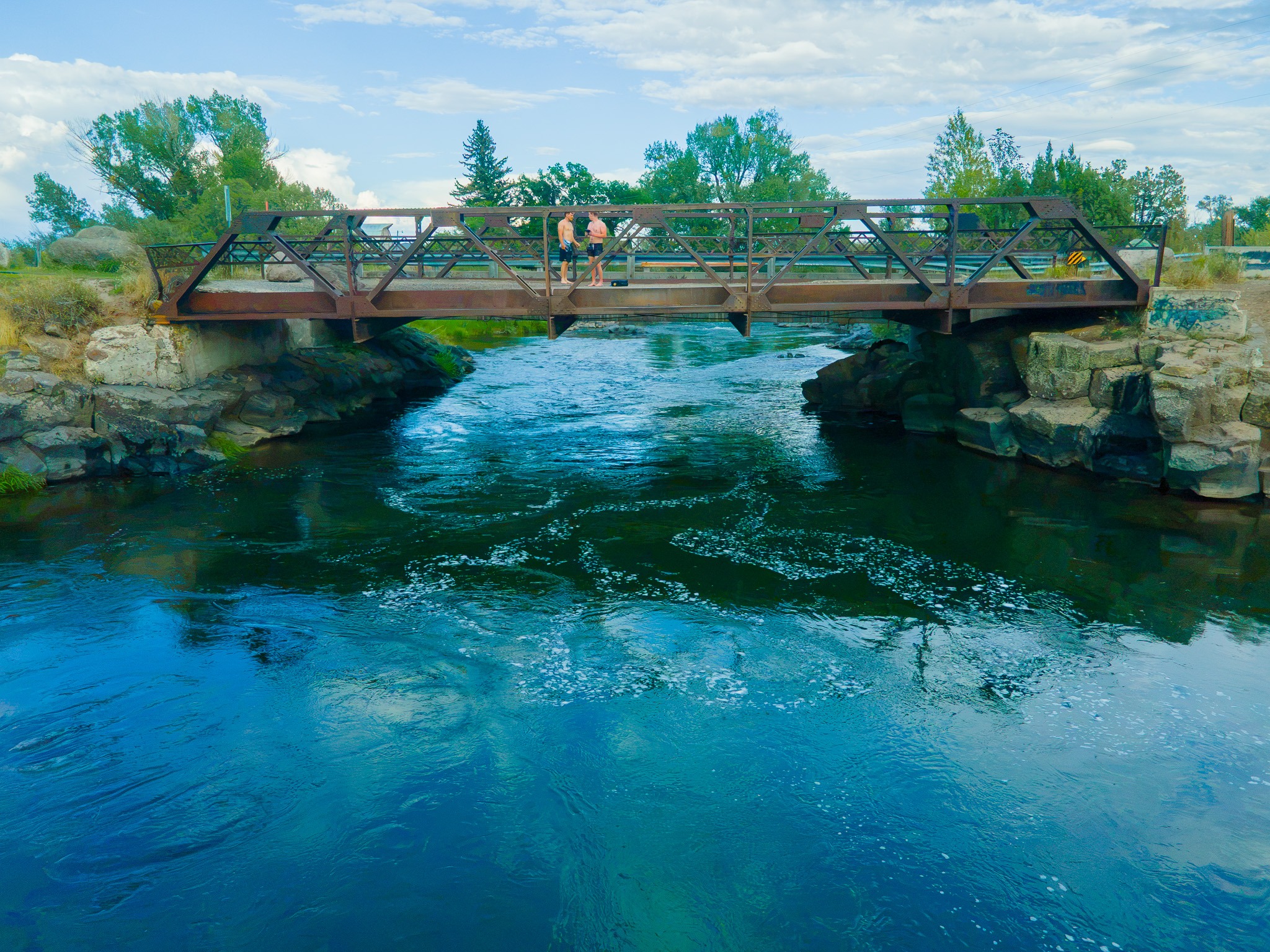 The teal-colored water below Twin Bridges near Rexburg, Idaho