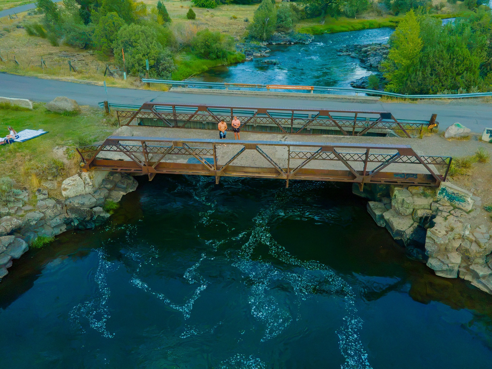 Aerial overview of Twin Bridges near Rexburg, Idaho, showing both bridges and the grassy riverbank